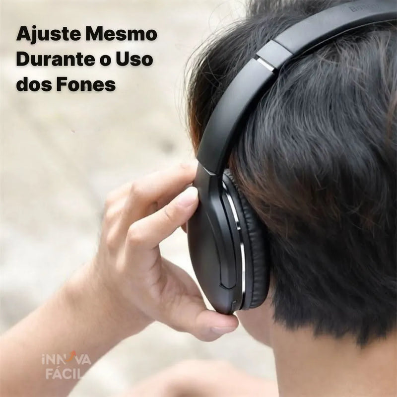 Wireless Baseus Pro headphones being adjusted on a person's head, showcasing comfort and water resistance ideal for sports and outdoor activities.