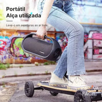 Portable Tronsmart Bang 60W speaker with handle, perfect for outdoor adventures.